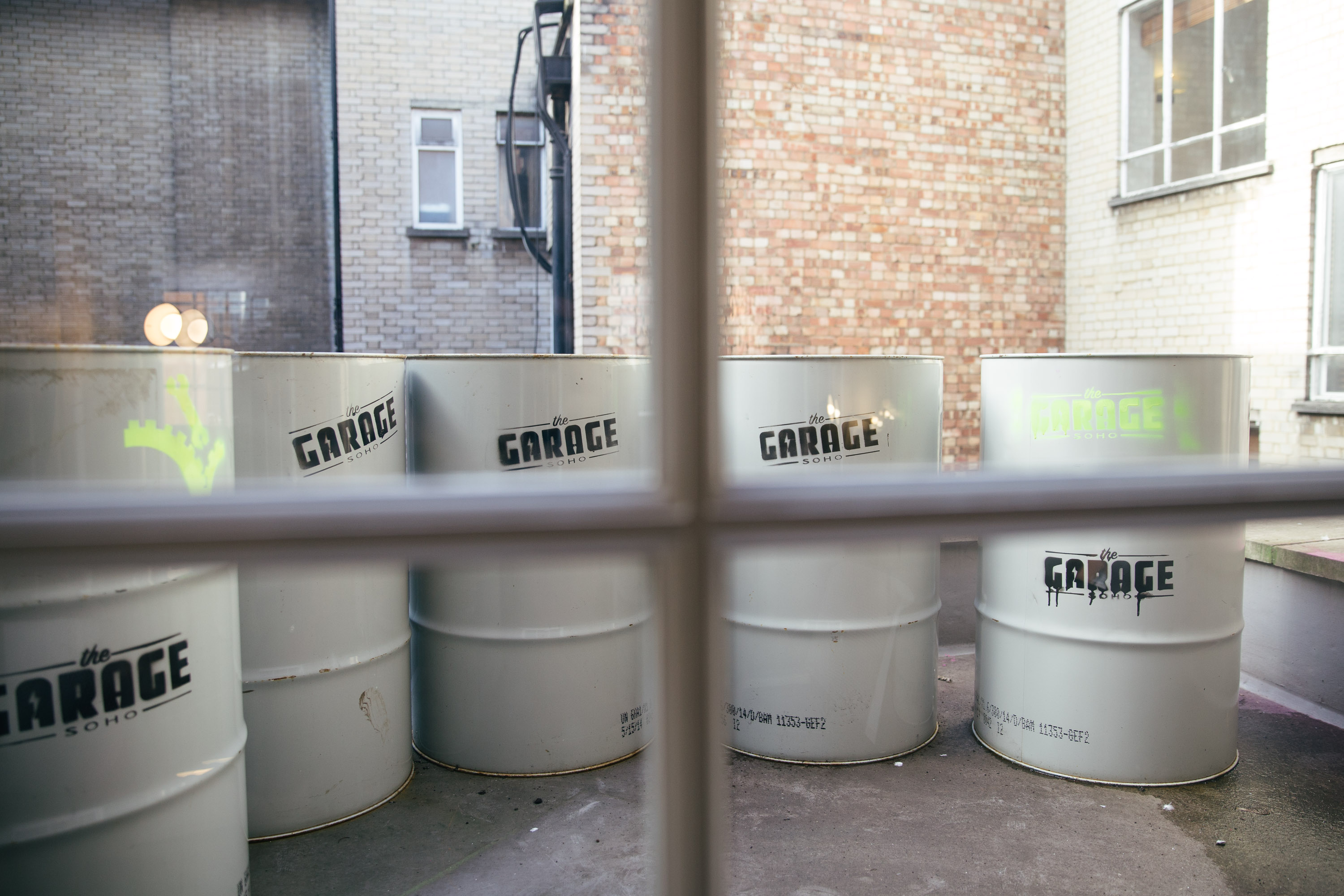 The Garage Soho Oil Canisters with Graffiti