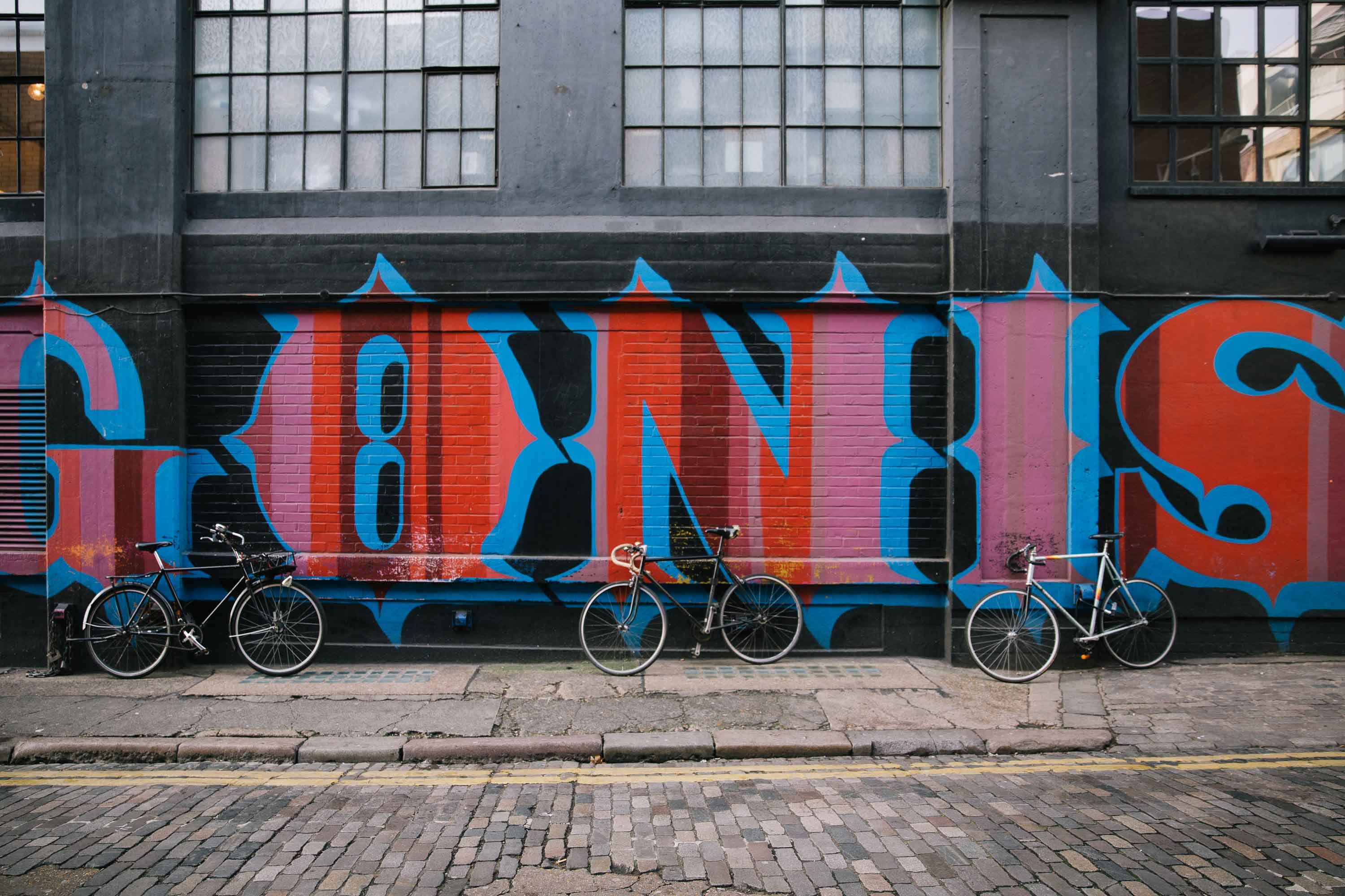 graffiti wall with bikes