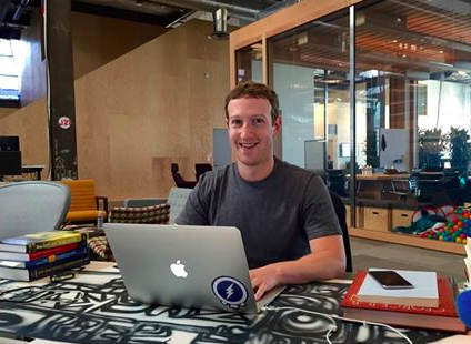 mark zuckerberg sitting at desk at facebook 