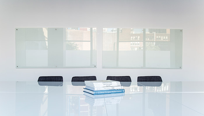 Corporate boardroom with four chairs